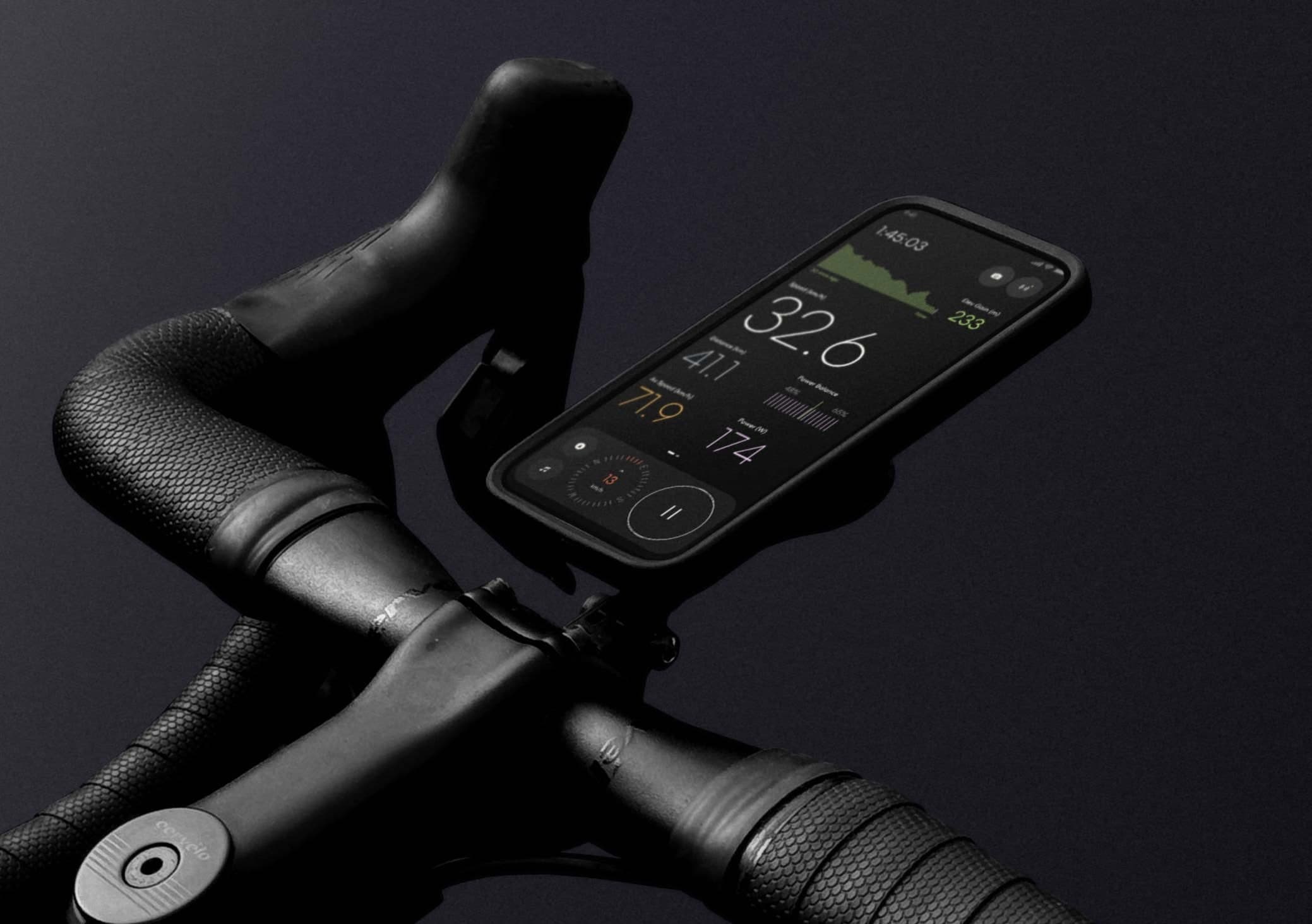 iPhone mounted on a road bike showing the Ride app dashboard