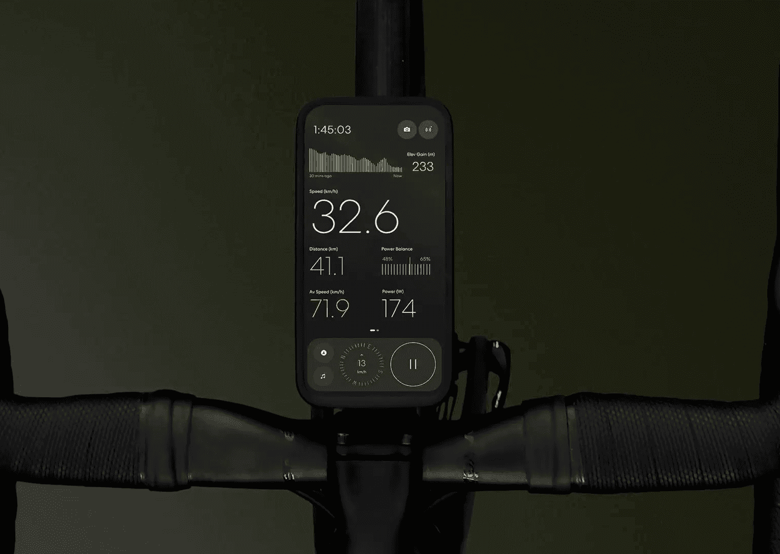 iPhone mounted on bike handlebars showing live power data